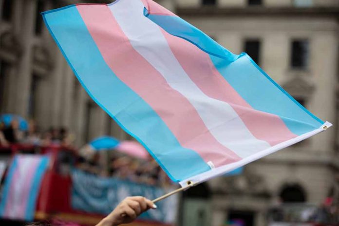 Transgender flag waving in a crowded street