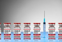 COVID-19 vaccine vials with syringe