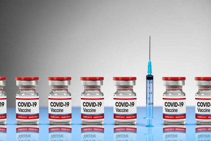 COVID-19 vaccine vials with syringe