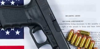 Gun and bullets on Second Amendment document.