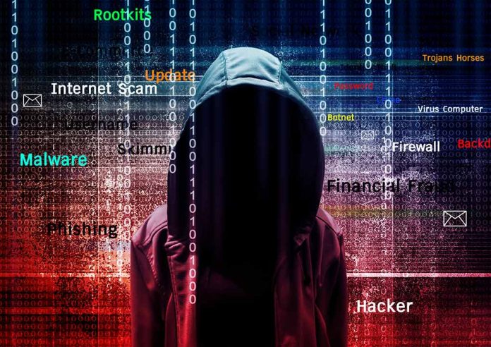 Hooded figure with cybersecurity-related words and binary code.