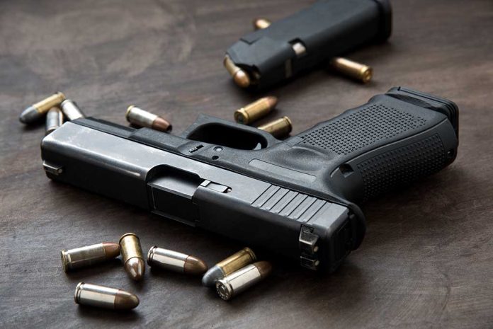 Handgun with bullets on a wooden surface.