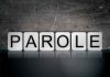 Blocks spelling PAROLE on grungy background.