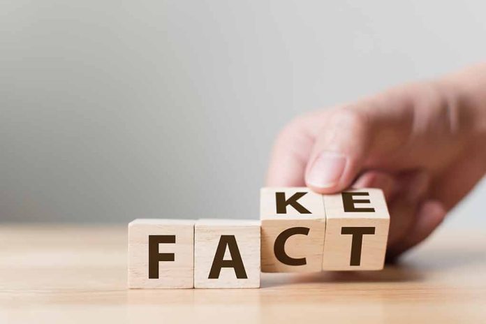 Hand flipping blocks between fact and fake