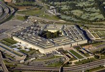 Aerial view of a large five-sided building.