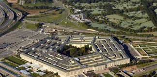 Aerial view of a large five-sided building.