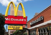 McDonald's restaurant with large advertising sign outside.