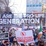 Prolife march with large banner and signs