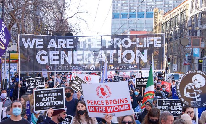 Prolife march with large banner and signs