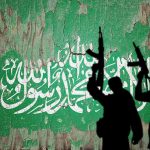 Silhouettes with rifles over Saudi flag background.