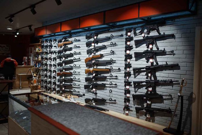 Wall display of various rifles in a gun store.