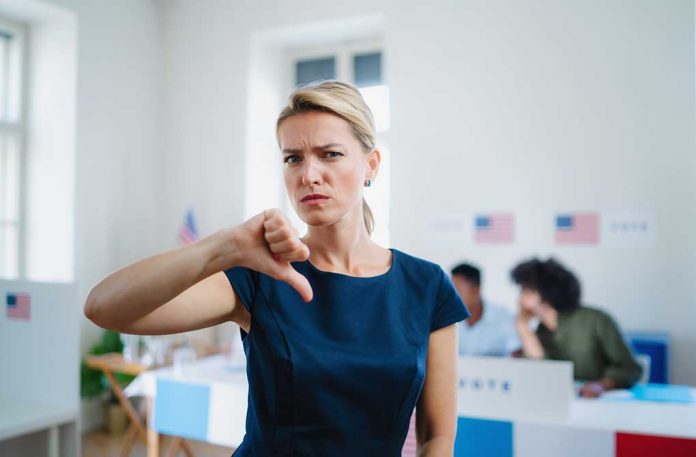 Woman with thumbs down in voting location.