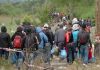 Group of people walking on a rural path