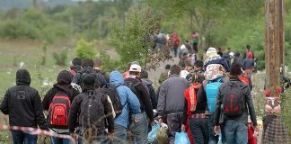 Group of people walking on a rural path