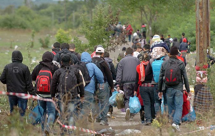 Group of people walking on a rural path