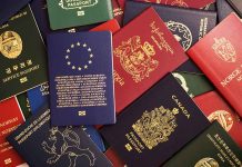 Various colorful international passports spread out.