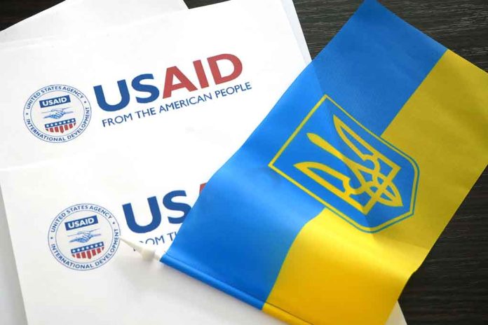 USAID documents with Ukrainian flag on table