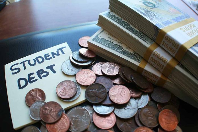 Note with student debt, coins, and banknotes.