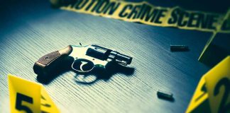 Revolver on table at crime scene investigation display