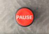 Red button labeled "PAUSE" on gray background.